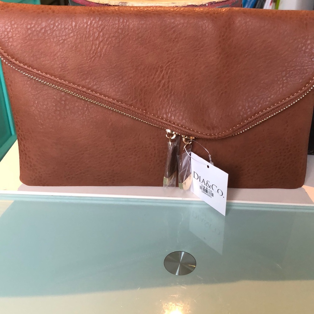 Brand new clutch with gold chain optional strap